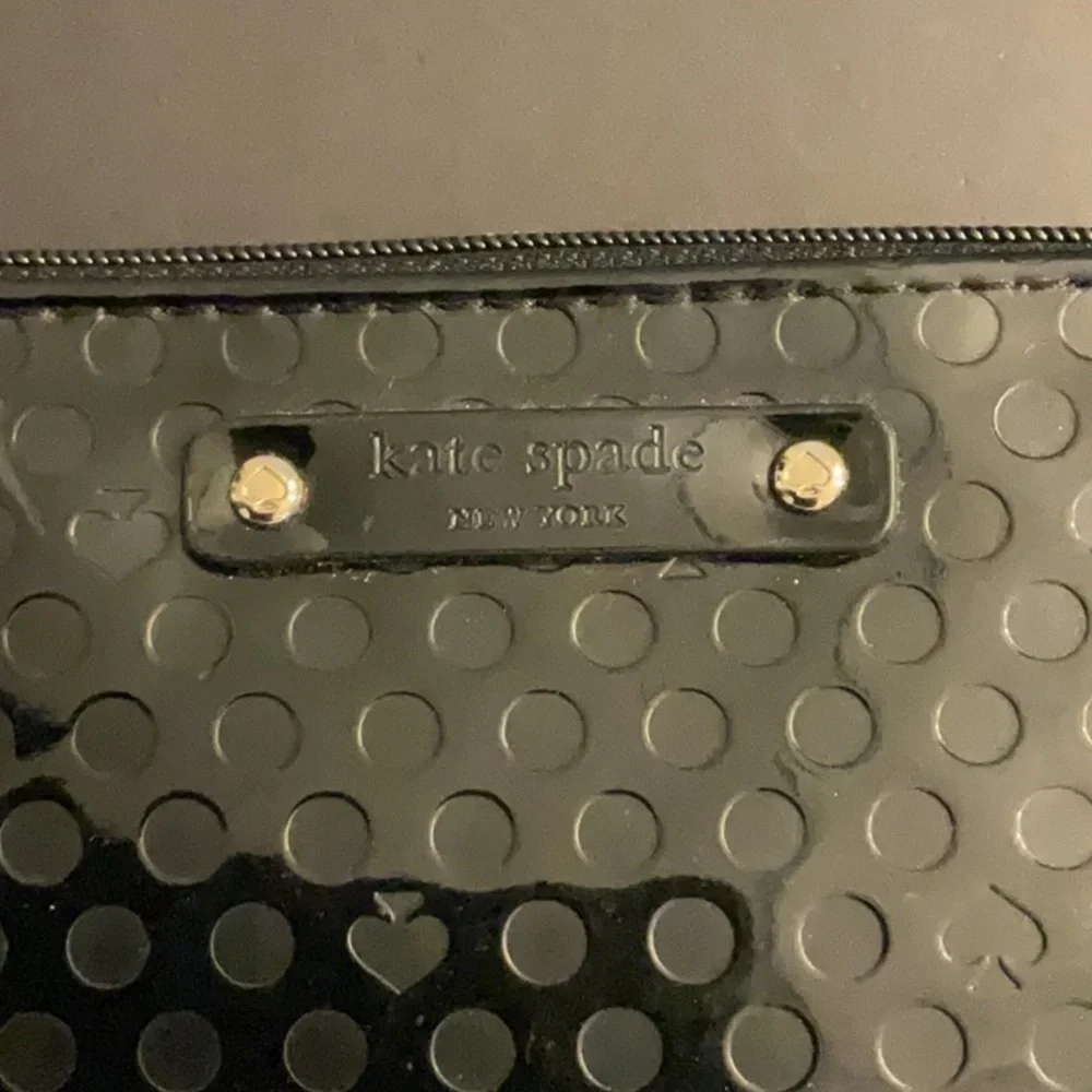 Kate Spade shiny black wristlet w/dots & logo spades